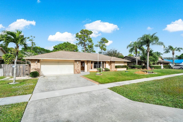 ranch-style home with driveway, an attached garage, fence, a front lawn, and brick siding