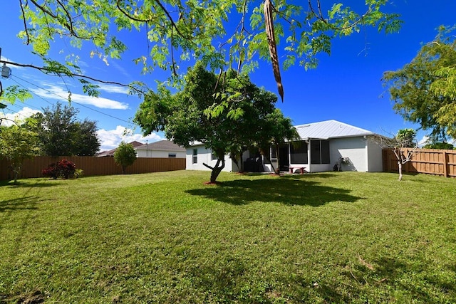 view of yard featuring a sunroom