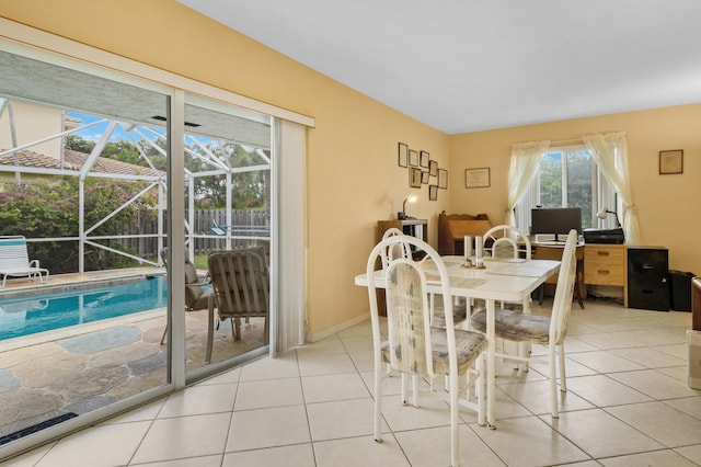 dining space featuring light tile patterned flooring