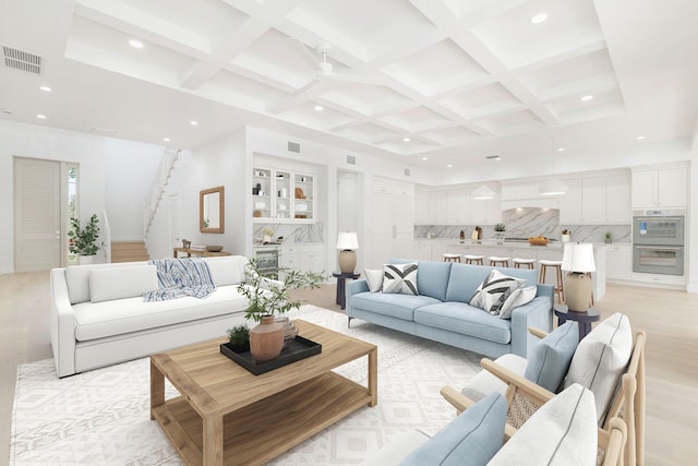 living area featuring visible vents, beamed ceiling, stairway, recessed lighting, and coffered ceiling