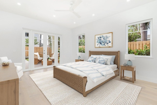 bedroom with light wood-style floors, recessed lighting, access to outside, french doors, and a ceiling fan