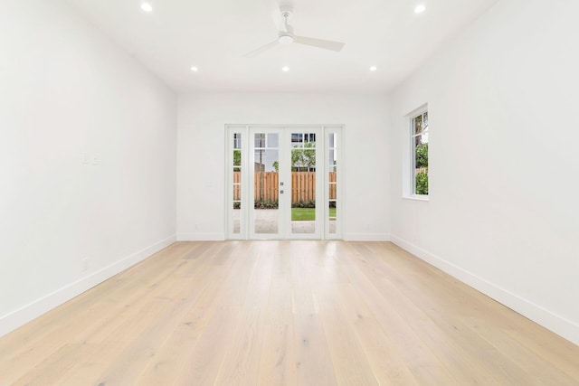 unfurnished room featuring light hardwood / wood-style flooring, french doors, and ceiling fan