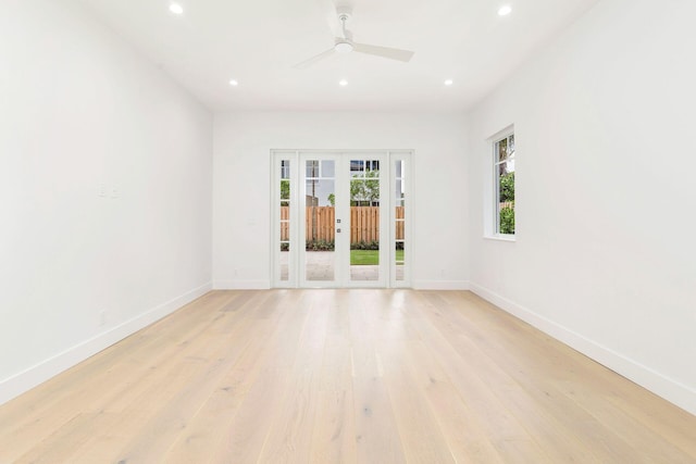unfurnished room with baseboards, french doors, and recessed lighting