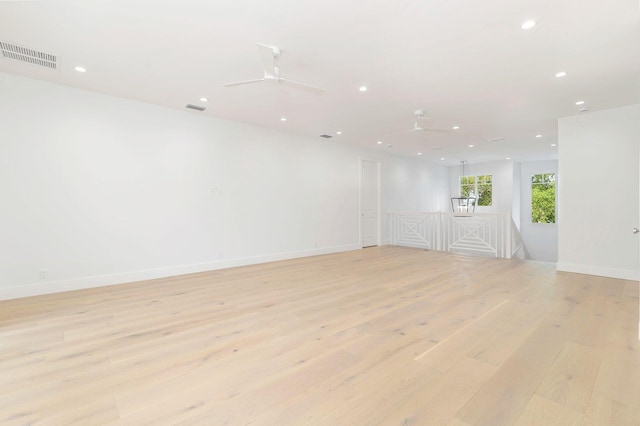 spare room with recessed lighting, a ceiling fan, light wood-style flooring, and visible vents