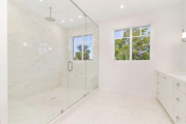 bathroom with vanity, plenty of natural light, a stall shower, and recessed lighting