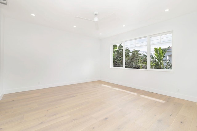 empty room with recessed lighting, baseboards, ceiling fan, and light wood finished floors