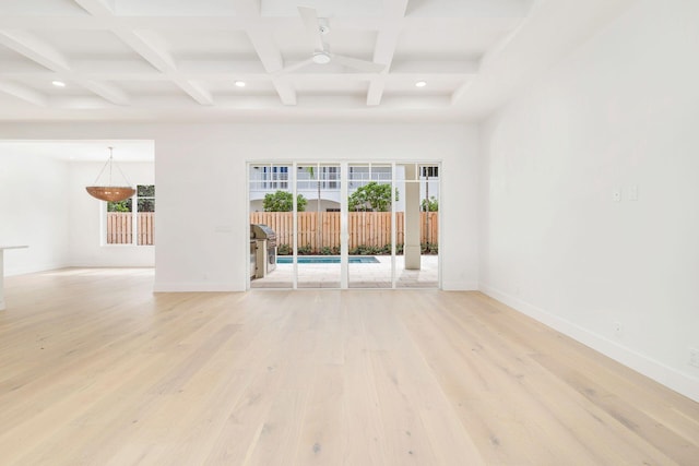 unfurnished room featuring beam ceiling, baseboards, light wood-type flooring, recessed lighting, and coffered ceiling