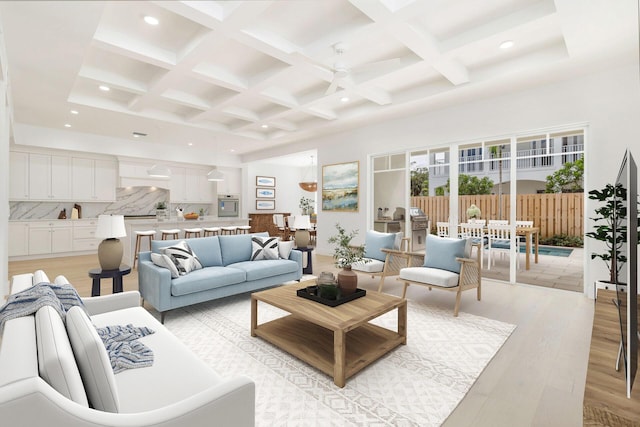 living room featuring a ceiling fan, beamed ceiling, coffered ceiling, and light wood-style flooring