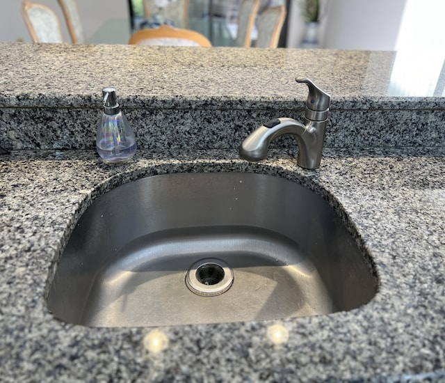 room details with stone countertops and sink