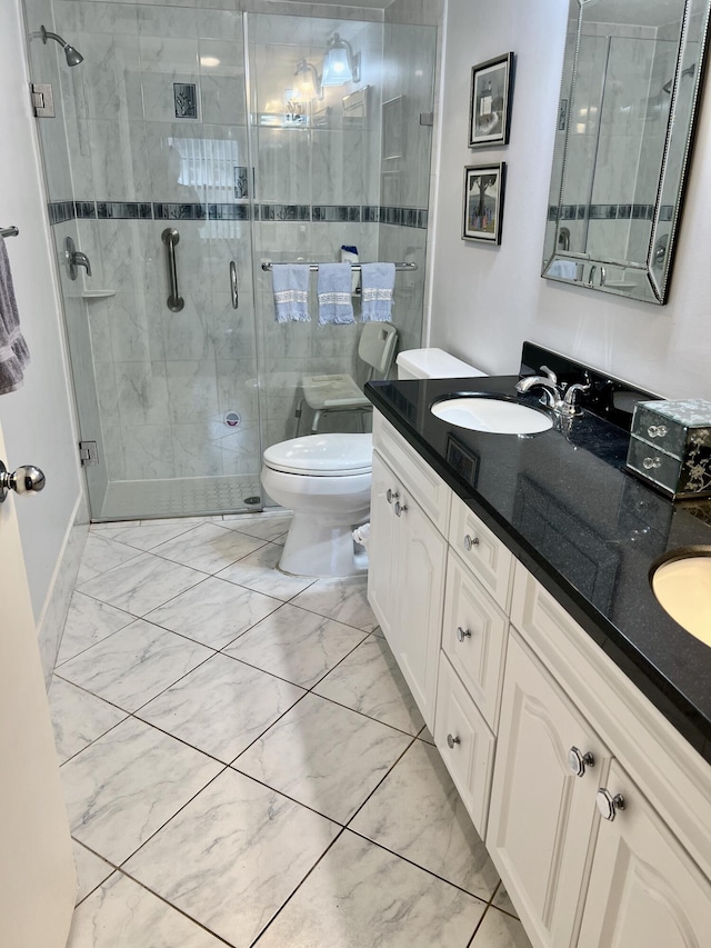 full bath with toilet, a sink, marble finish floor, a shower stall, and double vanity