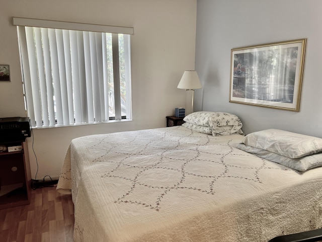 bedroom featuring wood finished floors