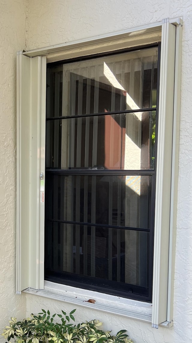 exterior details featuring stucco siding