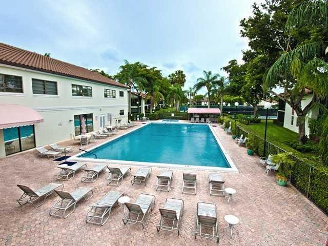 pool featuring a patio area and fence