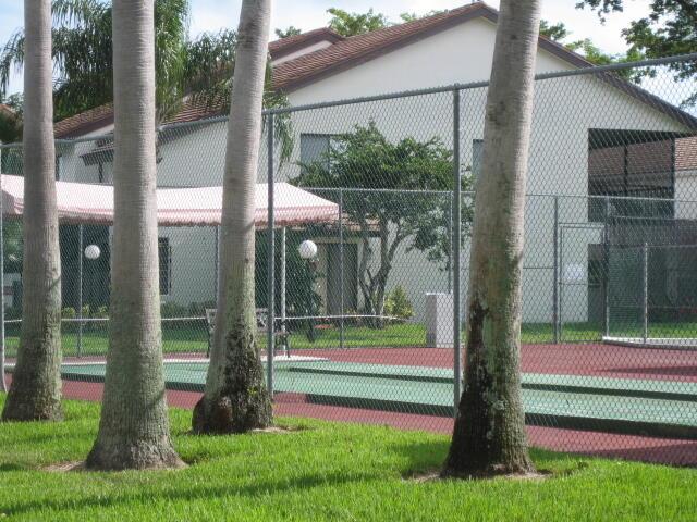 view of tennis court with fence