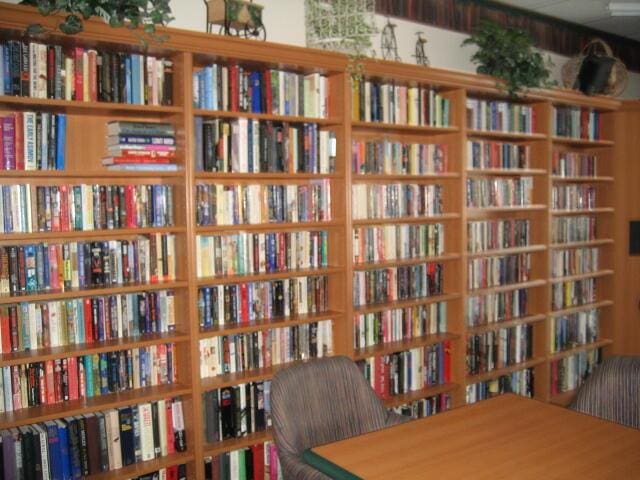 10915 Palm Lake Ave Unit 102, Boynton Beach, FL 33437 - sitting room featuring bookshelves