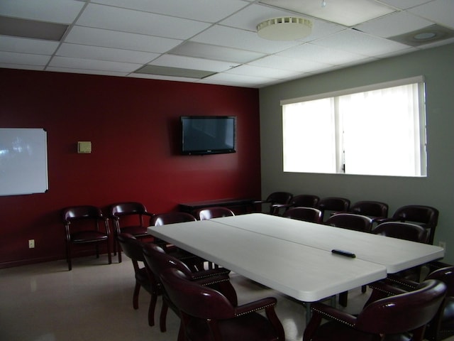 dining space with a paneled ceiling