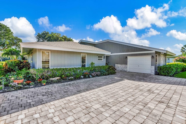 ranch-style home with a garage