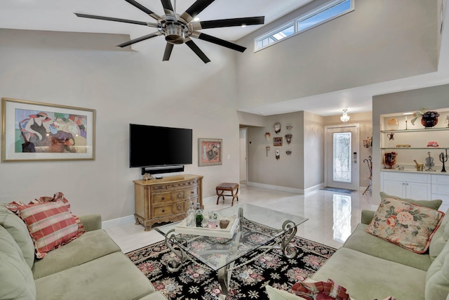 living room featuring a wealth of natural light, high vaulted ceiling, and ceiling fan