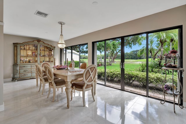 dining area with light tile patterned floors