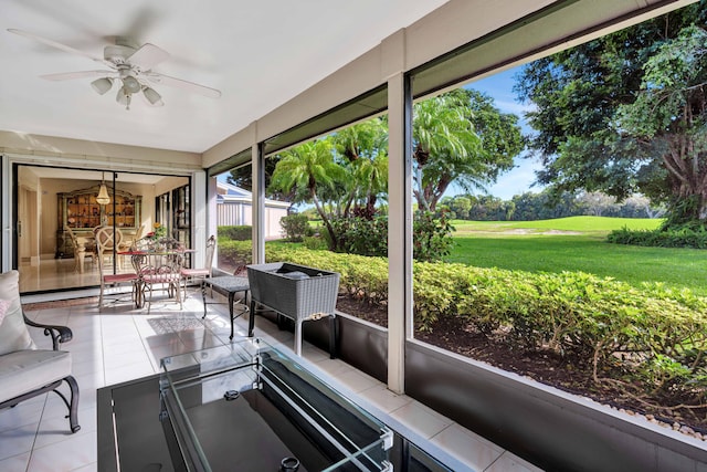 sunroom / solarium with ceiling fan