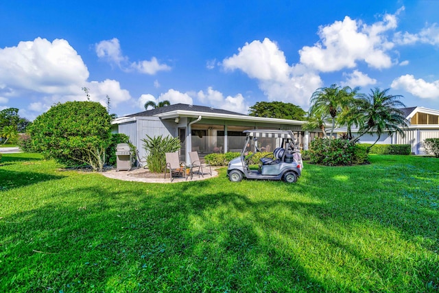 rear view of house with a lawn