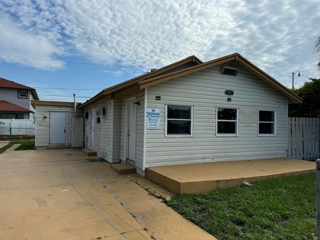 view of side of property with a patio