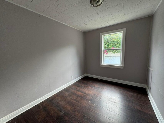 empty room featuring dark hardwood / wood-style floors