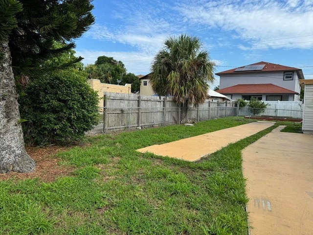 view of yard with a fenced backyard and a patio