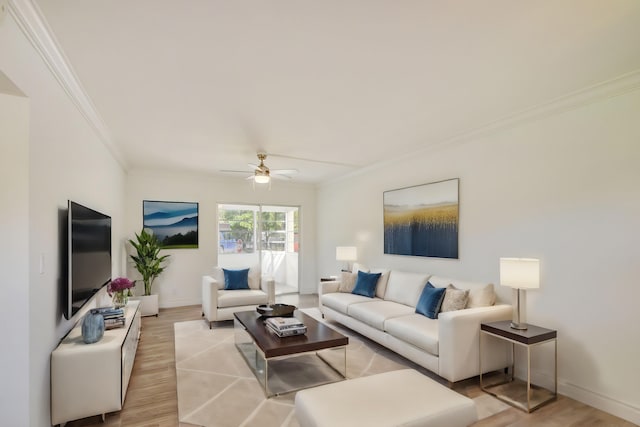 living room featuring crown molding, light hardwood / wood-style flooring, and ceiling fan