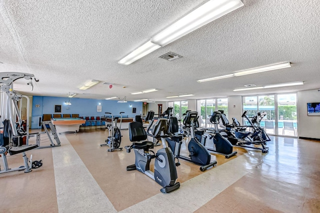 workout area featuring a textured ceiling