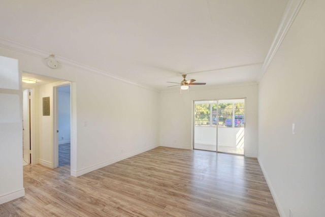 spare room featuring crown molding, light hardwood / wood-style flooring, and ceiling fan