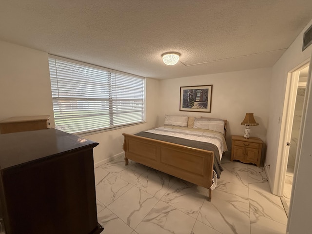 bedroom featuring a textured ceiling