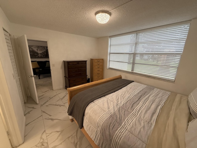 bedroom with a textured ceiling