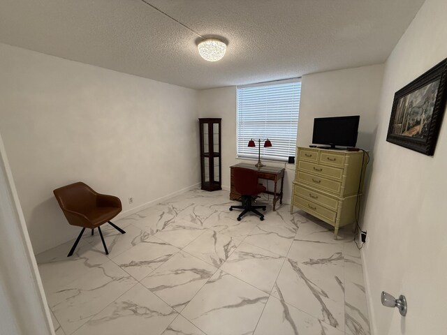 office area featuring a textured ceiling