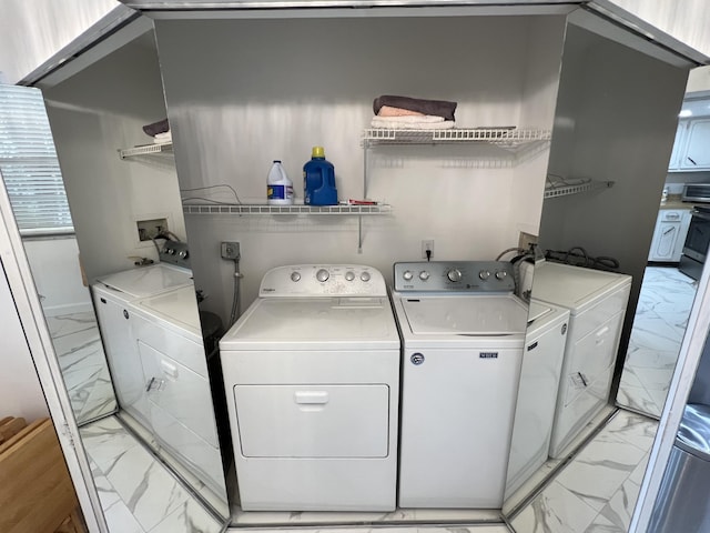 laundry area featuring separate washer and dryer