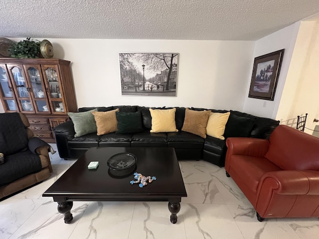 living room with a textured ceiling