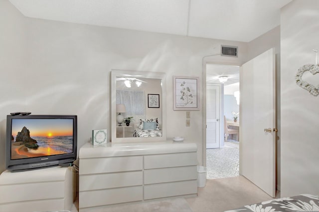 bedroom with light colored carpet