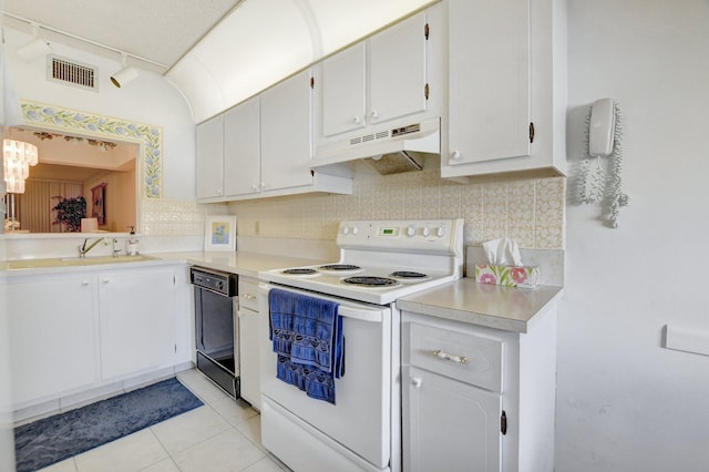 kitchen featuring electric range, sink, dishwasher, white cabinets, and track lighting