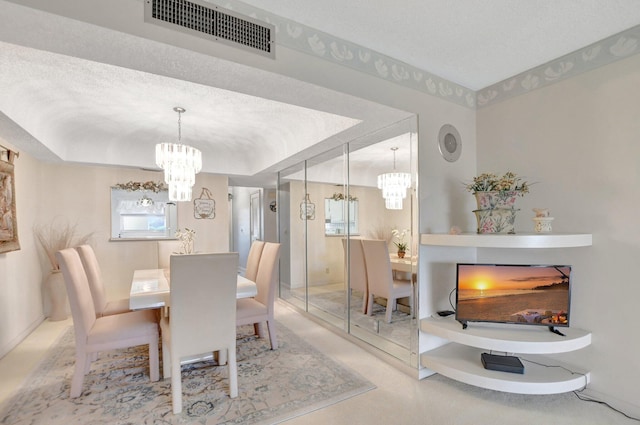 dining area featuring a textured ceiling