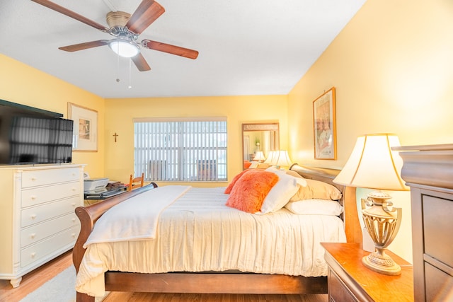 bedroom featuring ceiling fan and light hardwood / wood-style floors