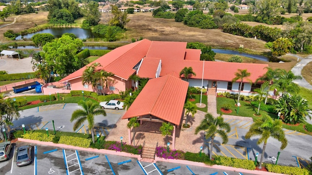 birds eye view of property with a water view