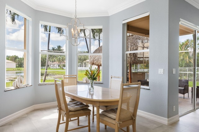 tiled dining room featuring ornamental molding and a chandelier