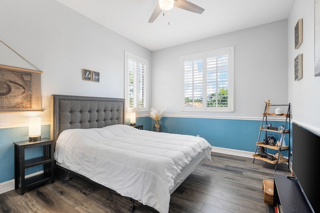 bedroom featuring ceiling fan and dark hardwood / wood-style flooring