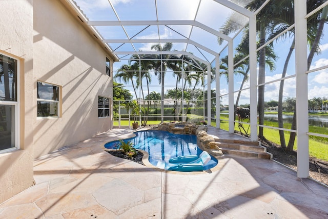 view of swimming pool with a patio and glass enclosure