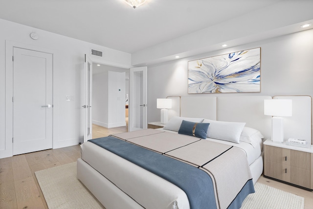 bedroom with light wood-type flooring