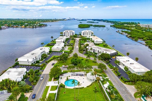 birds eye view of property with a water view