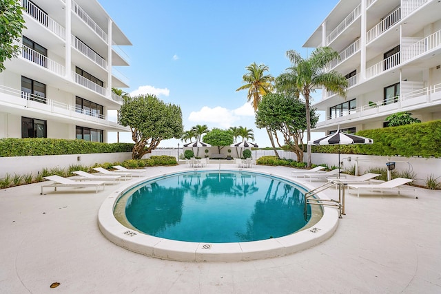 view of swimming pool with a patio