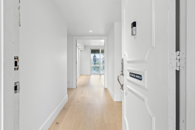 corridor featuring light hardwood / wood-style floors