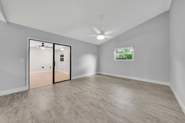 unfurnished bedroom featuring ceiling fan and lofted ceiling