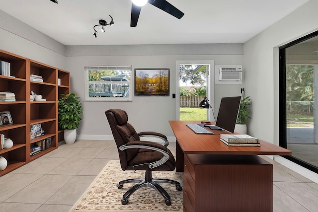 tiled office space featuring ceiling fan, plenty of natural light, and a wall mounted air conditioner